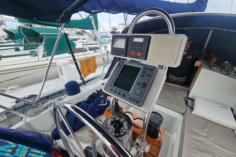 Slide: The Image of Cockpit of a 1990 Ericson 34 sailboat with navigation instruments and compass. - 6