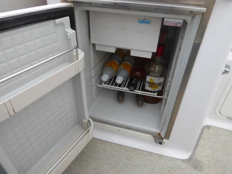 Slide: The Image of Open fridge on Chris-Craft Corsair 25 boat, stocked with beverages. - 13