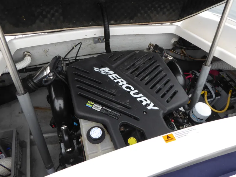 Slide: The Image of Engine compartment of a 2004 Chris-Craft Corsair 25 with Mercury engine. - 16