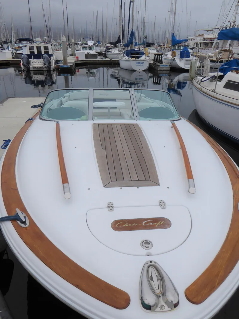 Slide: The Image of 2004 Chris-Craft Corsair 25 boat docked in marina. - 2