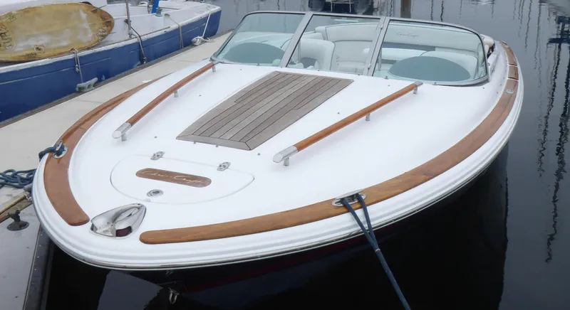 Slide: The Image of 2004 Chris-Craft Corsair 25 boat docked in harbor. - 3