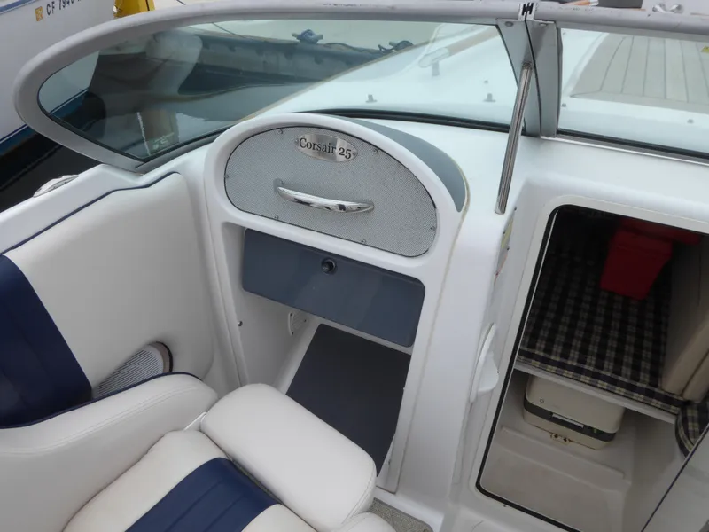 Slide: The Image of Interior of a 2004 Chris-Craft Corsair 25 boat, white and blue upholstery. - 8
