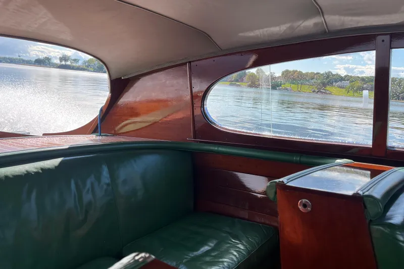 Slide: The Image of Interior of a 1948 Chris-Craft 24 Sportsman boat with green leather seating. - 10