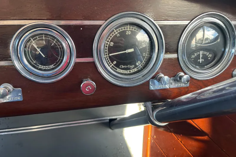 Slide: The Image of Dashboard of a 1948 Chris-Craft 24 Sportsman with vintage gauges and controls. - 14