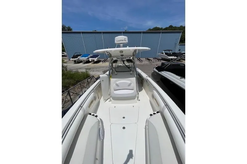 The Image of 2008 Boston Whaler 320 Outrage boat with Garmin equipment, docked outdoors. - 0