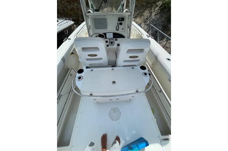 Slide: The Image of 2008 Boston Whaler 320 Outrage boat interior with helm and seating area. - 11