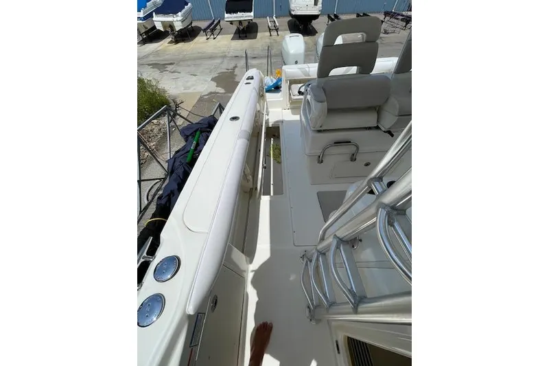 Slide: The Image of 2008 Boston Whaler 320 Outrage boat interior with seating and deck view. - 13