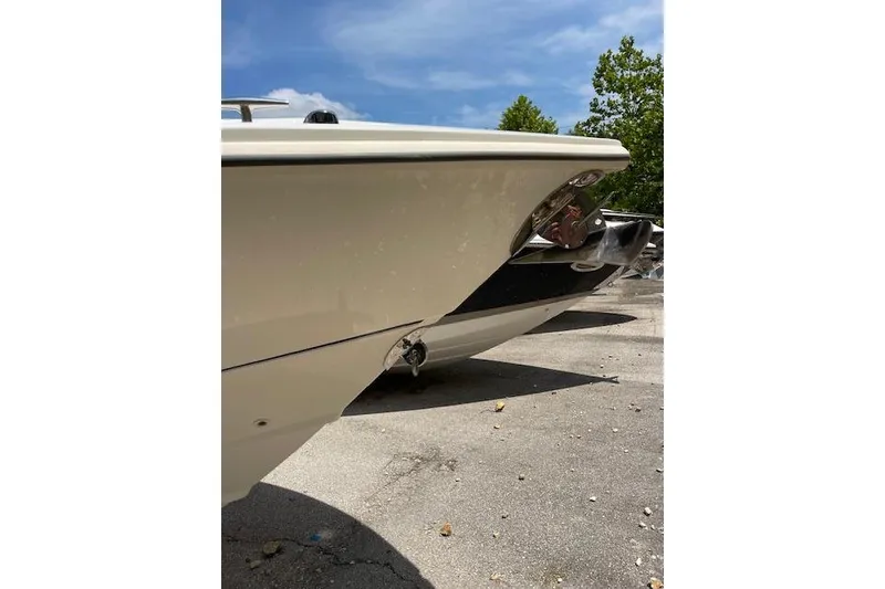 Slide: The Image of 2008 Boston Whaler 320 Outrage boat bow under clear blue sky. - 14
