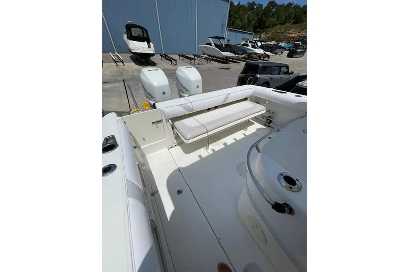 Slide: The Image of 2008 Boston Whaler 320 Outrage boat interior with seating and dual engines. - 15