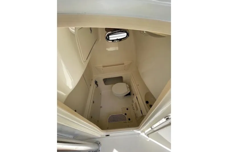 Slide: The Image of 2008 Boston Whaler 320 Outrage boat interior with compact marine toilet. - 17