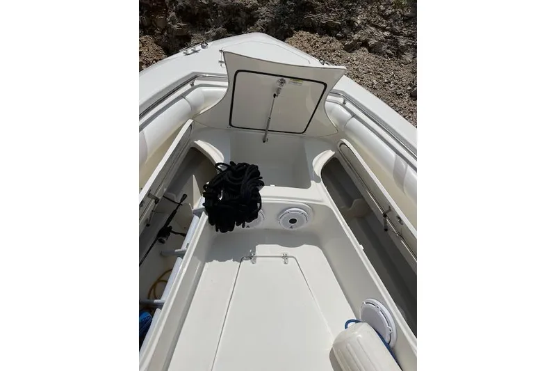 Slide: The Image of 2008 Boston Whaler 320 Outrage boat interior with open storage compartment. - 20