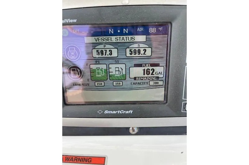 Slide: The Image of SmartCraft display on 2008 Boston Whaler 320 Outrage showing vessel status and fuel levels. - 8