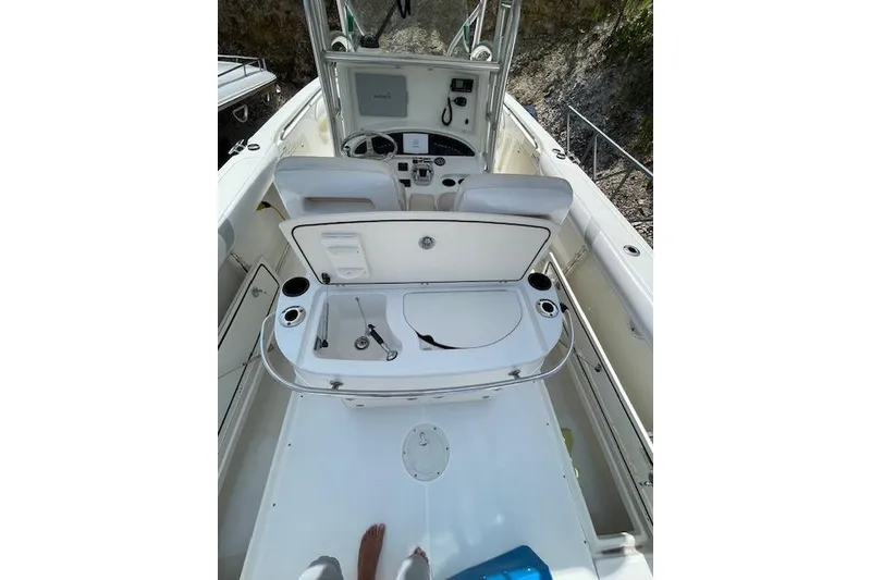 Slide: The Image of 2008 Boston Whaler 320 Outrage boat interior with open storage compartment. - 9