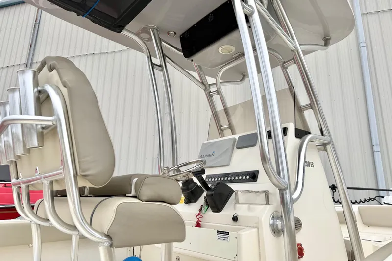 Slide: The Image of 2021 Key West 239 FS boat console with seating and navigation equipment. - 14