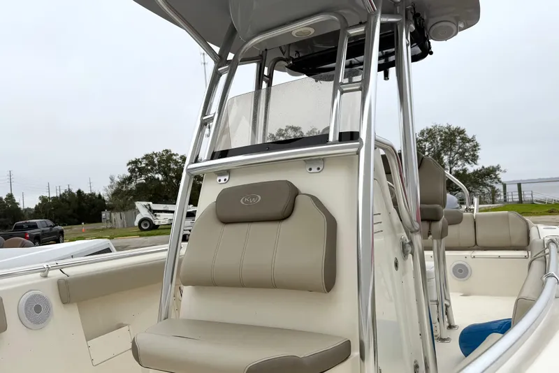 Slide: The Image of 2021 Key West 239 FS boat with beige seating and stainless steel frame. - 16