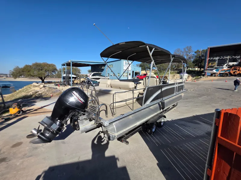 Slide: The Image of 2021 Harris FloteBote 250CR pontoon boat on a trailer. - 10