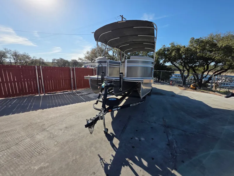 Slide: The Image of 2021 Harris FloteBote 250CR pontoon boat on trailer. - 6