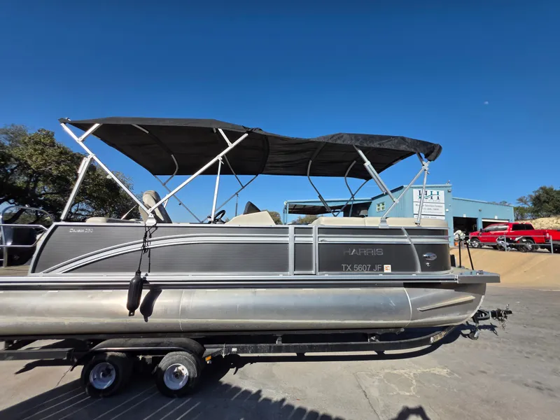 Slide: The Image of 2021 Harris FloteBote 250CR pontoon boat on trailer. - 7