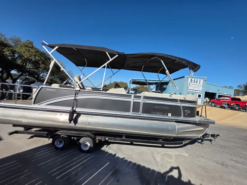 Slide: The Image of 2021 Harris FloteBote 250CR pontoon boat on trailer. - 9