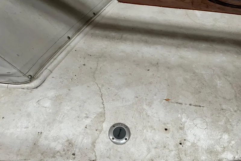 Slide: The Image of 1958 Chris-Craft 31 Sedan Cruiser deck with metal fixture and textured surface. - 13