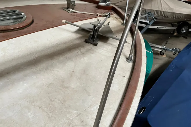 Slide: The Image of 1958 Chris-Craft 31 Sedan Cruiser deck with anchor and railing in storage. - 14