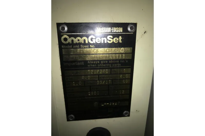 Slide: The Image of Onan GenSet label on 1958 Chris-Craft 31 Sedan Cruiser, displaying model and specifications. - 18