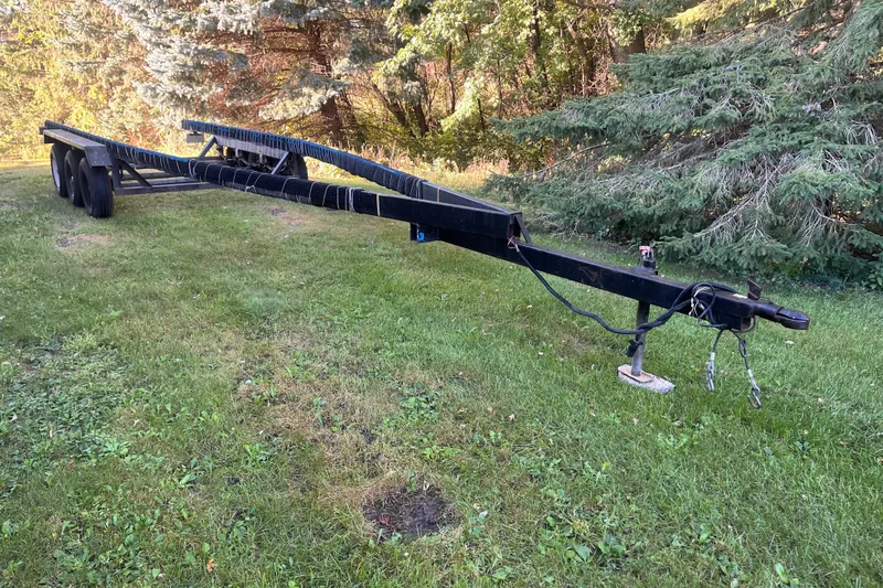 Slide: The Image of Trailer for 1958 Chris-Craft 31 Sedan Cruiser on grassy area with trees in background. - 24