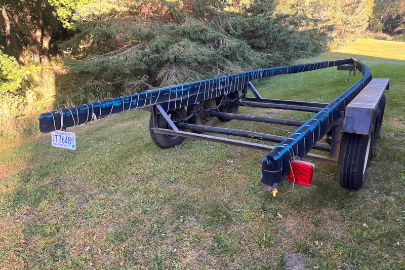 Slide: The Image of Trailer for 1958 Chris-Craft 31 Sedan Cruiser on grassy area with trees. - 26