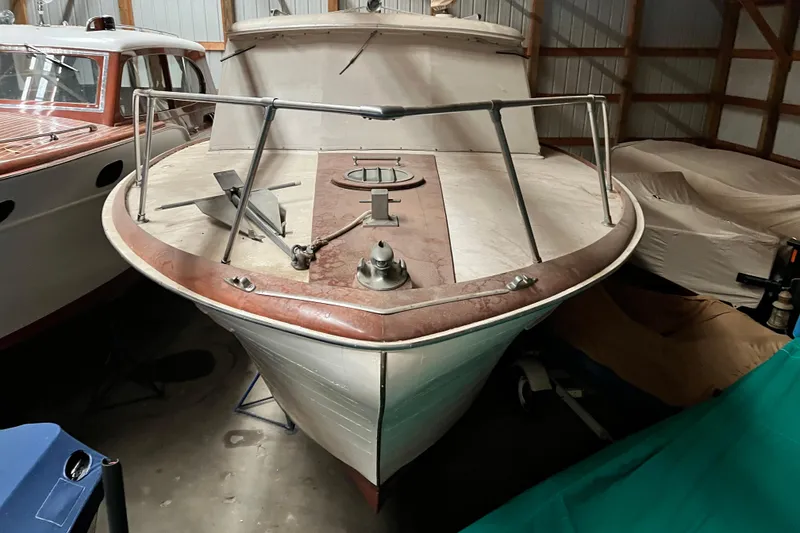 Slide: The Image of 1958 Chris-Craft 31 Sedan Cruiser in storage, showcasing classic design and vintage charm. - 7