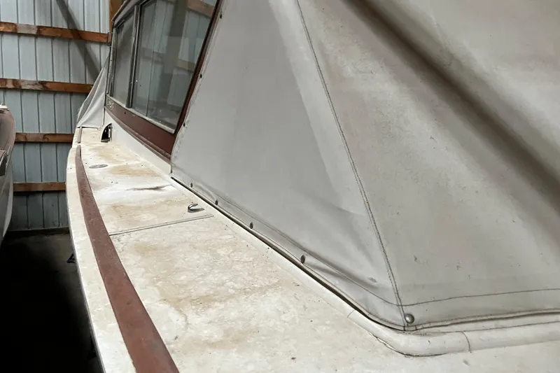 Slide: The Image of 1958 Chris-Craft 31 Sedan Cruiser in storage, showcasing vintage design details. - 9