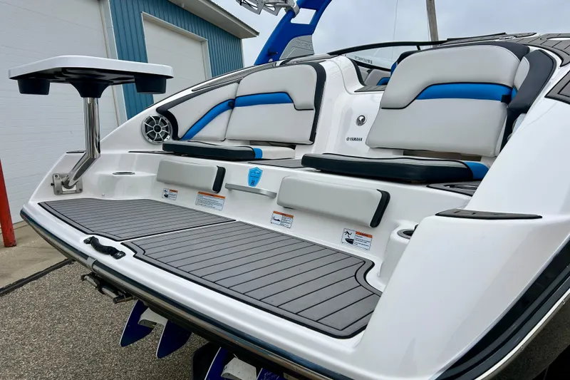 Slide: The Image of 2018 Yamaha Boats 242X with sleek seating and modern design features. - 10