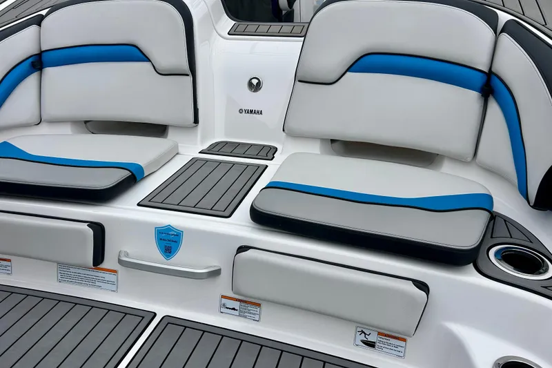 Slide: The Image of 2018 Yamaha Boats 242X interior seating with blue and gray accents. - 11
