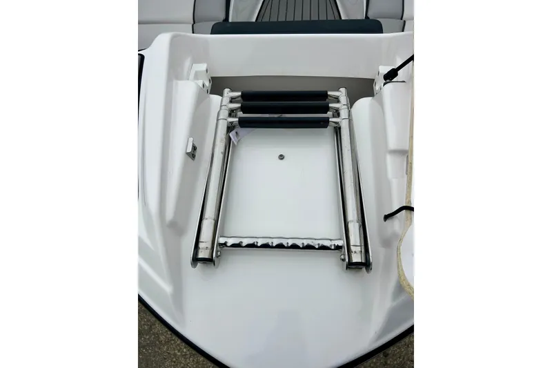 Slide: The Image of Foldable ladder on 2018 Yamaha Boats 242X deck, showcasing sleek design and functionality. - 17