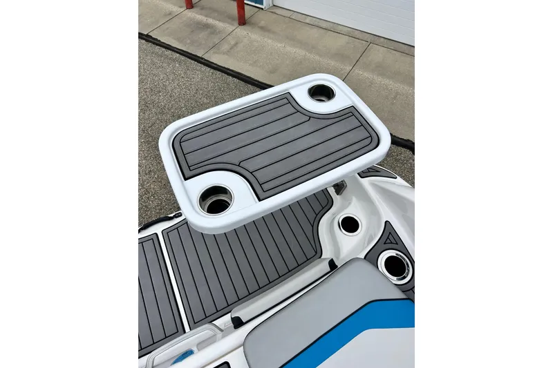 Slide: The Image of 2018 Yamaha Boats 242X swim platform with table and cup holders. - 18