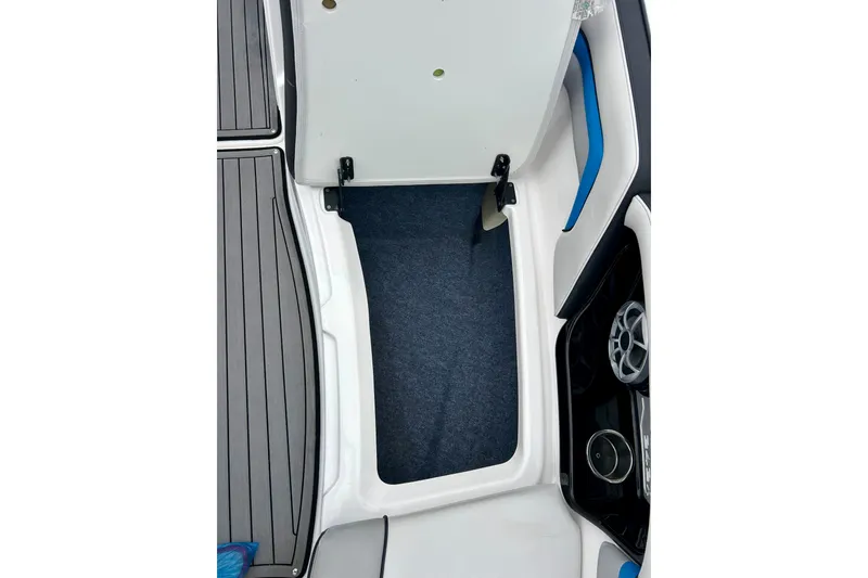 Slide: The Image of 2018 Yamaha Boats 242X interior storage compartment with speaker and cup holder. - 21