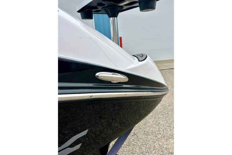 Slide: The Image of 2018 Yamaha Boats 242X, sleek black and white hull detail, close-up view. - 23