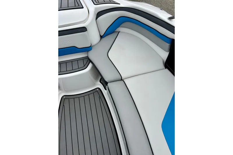 Slide: The Image of 2018 Yamaha Boats 242X interior seating with blue and gray accents. - 25