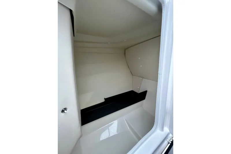 Slide: The Image of Interior storage compartment of 2018 Yamaha Boats 242X, featuring sleek design and ample space. - 29