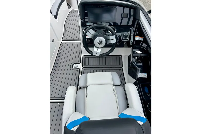 Slide: The Image of 2018 Yamaha Boats 242X cockpit with steering wheel and modern dashboard. - 30