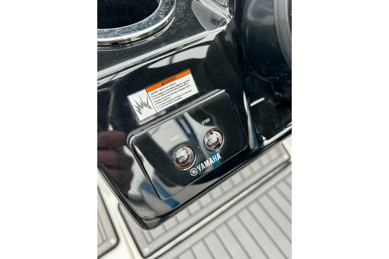 Slide: The Image of Control panel of 2018 Yamaha Boats 242X with start/stop buttons and warning label. - 42