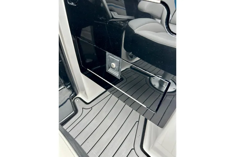 Slide: The Image of 2018 Yamaha Boats 242X interior with sleek black panel and seating. - 46