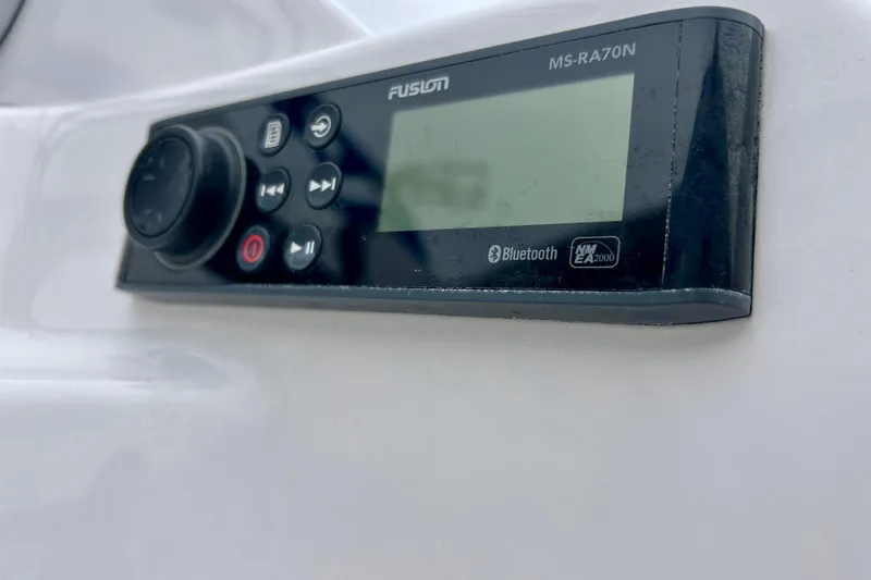 Slide: The Image of Fusion MS-RA70N audio system on 2018 Yamaha Boats 242X, featuring Bluetooth connectivity. - 52