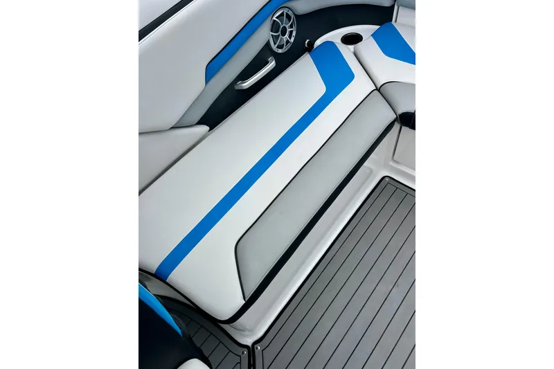 Slide: The Image of 2018 Yamaha Boats 242X interior seating with blue accents and speaker. - 53