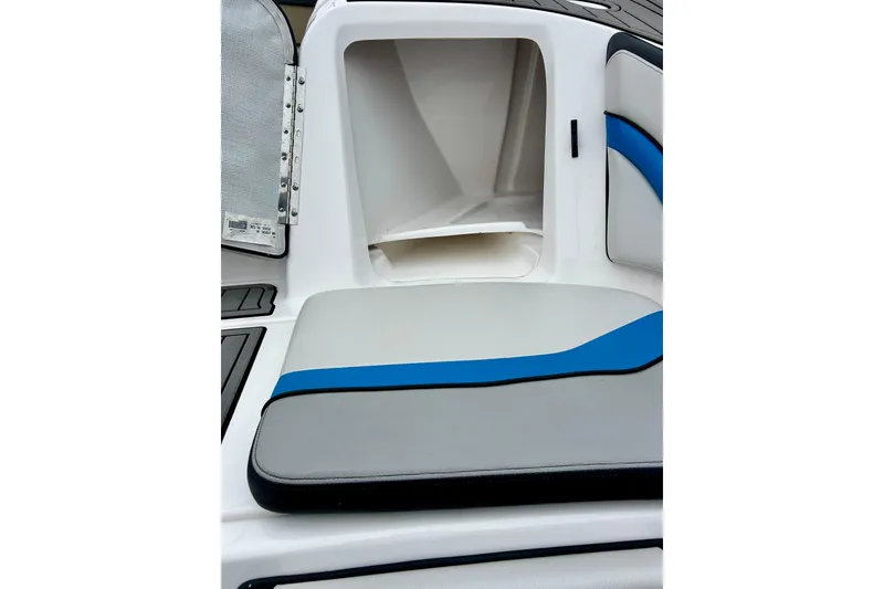 Slide: The Image of 2018 Yamaha Boats 242X interior storage compartment with cushioned seating. - 66