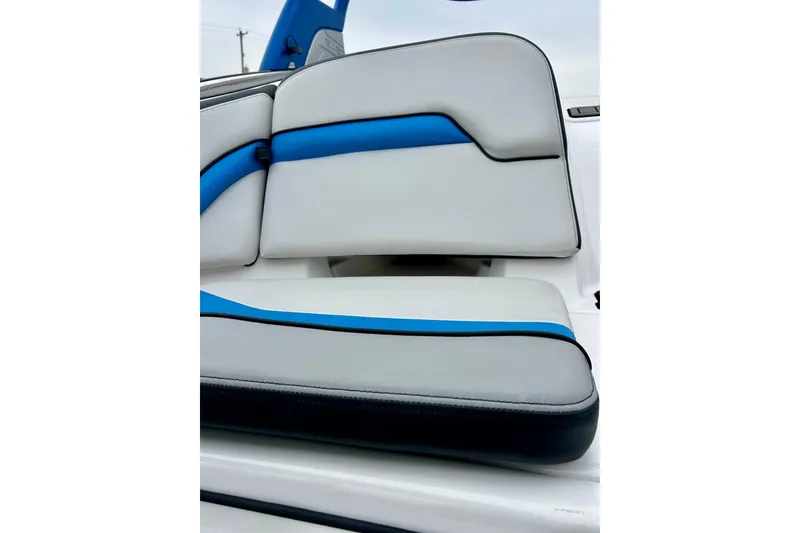 Slide: The Image of 2018 Yamaha Boats 242X interior seating with blue and white upholstery. - 67