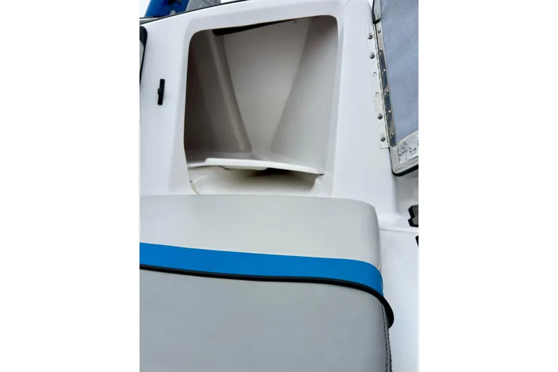 Slide: The Image of Interior view of 2018 Yamaha Boats 242X, featuring storage compartment and seating. - 68