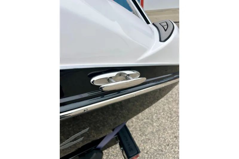 Slide: The Image of 2018 Yamaha Boats 242X, sleek design with chrome detailing on the hull. - 69