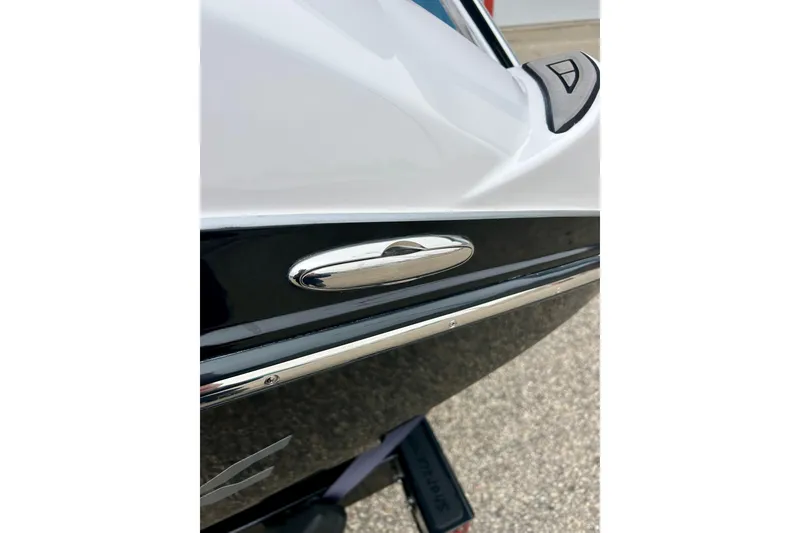 Slide: The Image of 2018 Yamaha Boats 242X close-up, showcasing sleek design and chrome detailing. - 70