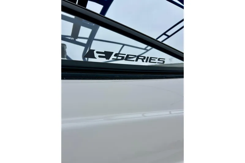 Slide: The Image of 2018 Yamaha Boats 242X E-Series logo on boat window. - 72