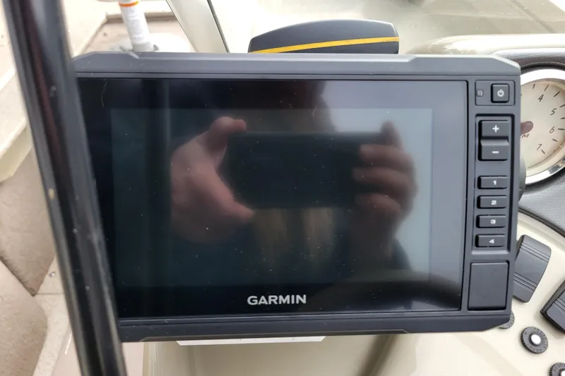 Slide: The Image of Garmin device on 2005 Lowe Fish & Ski 165 boat dashboard. - 13